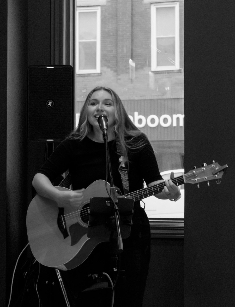 Jani Marie — local singer-songwriter performing with her guitar